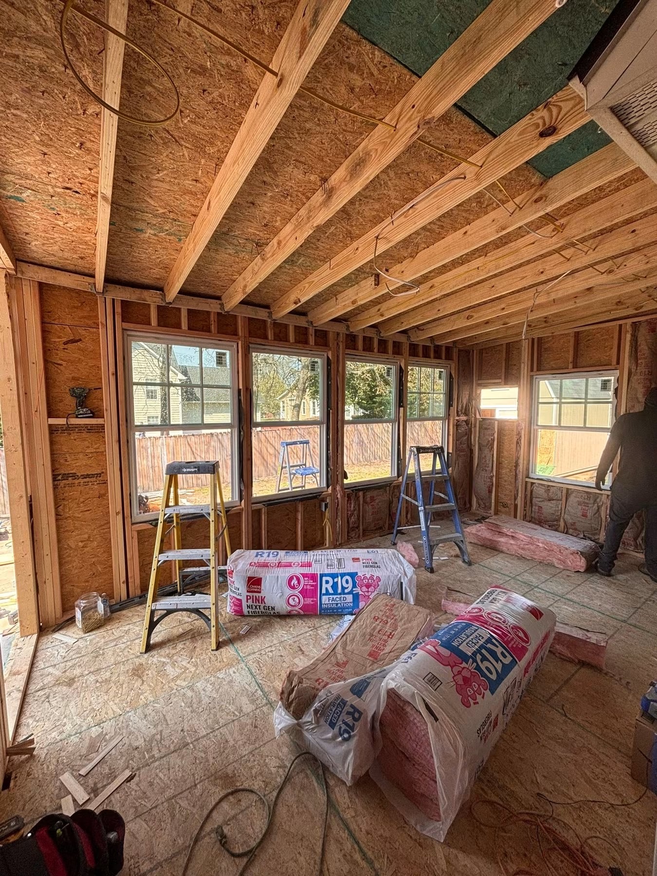 Framing, sheathing and R19 insulation for a new sunroom addition
