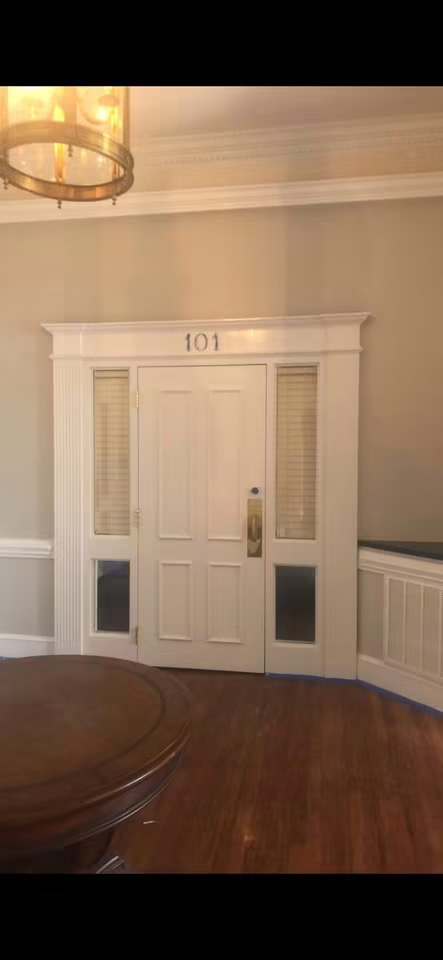 Refinished office entry door with custom trim and transom