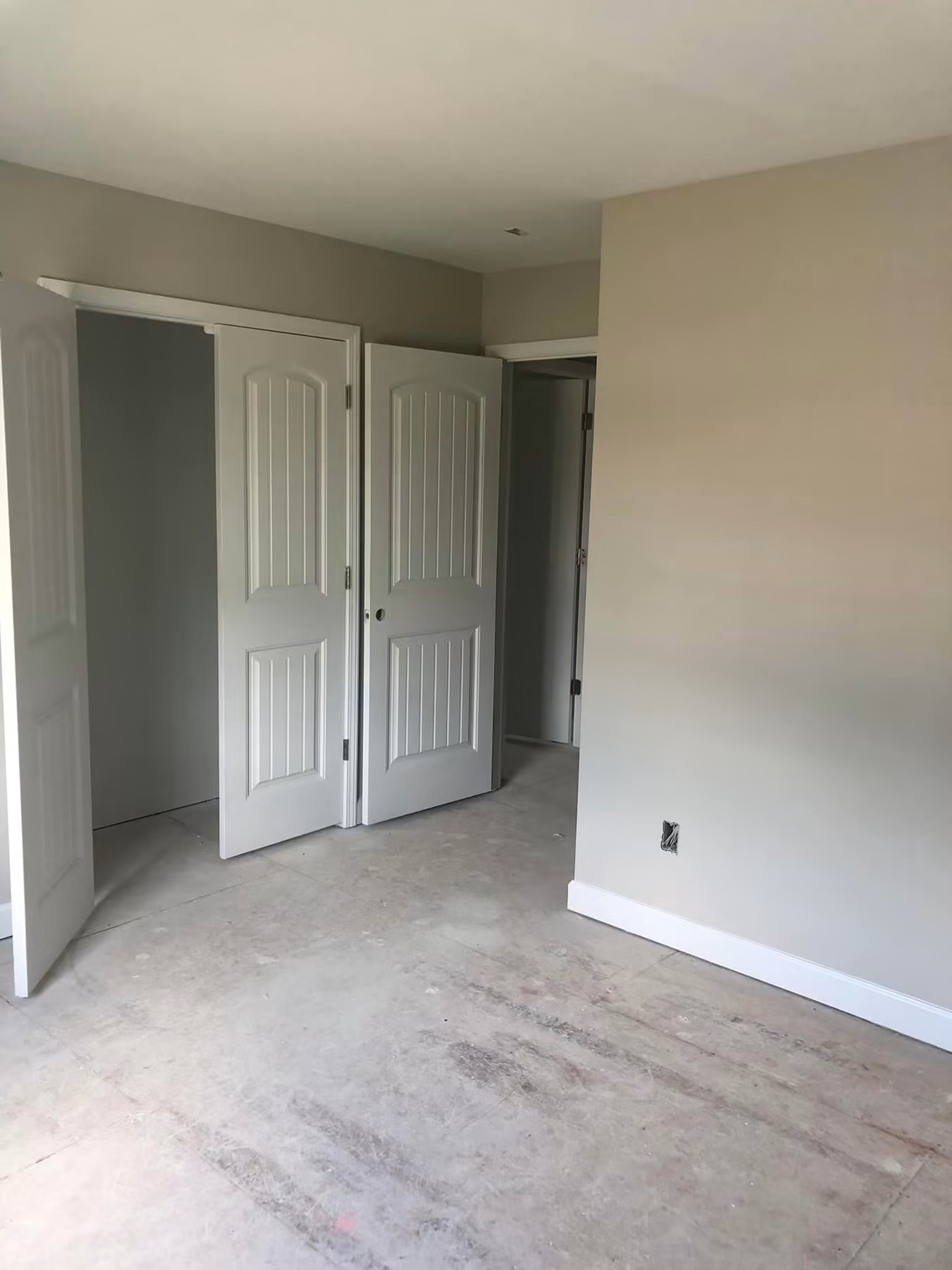 Finished bedroom with double closet doors and new trim
